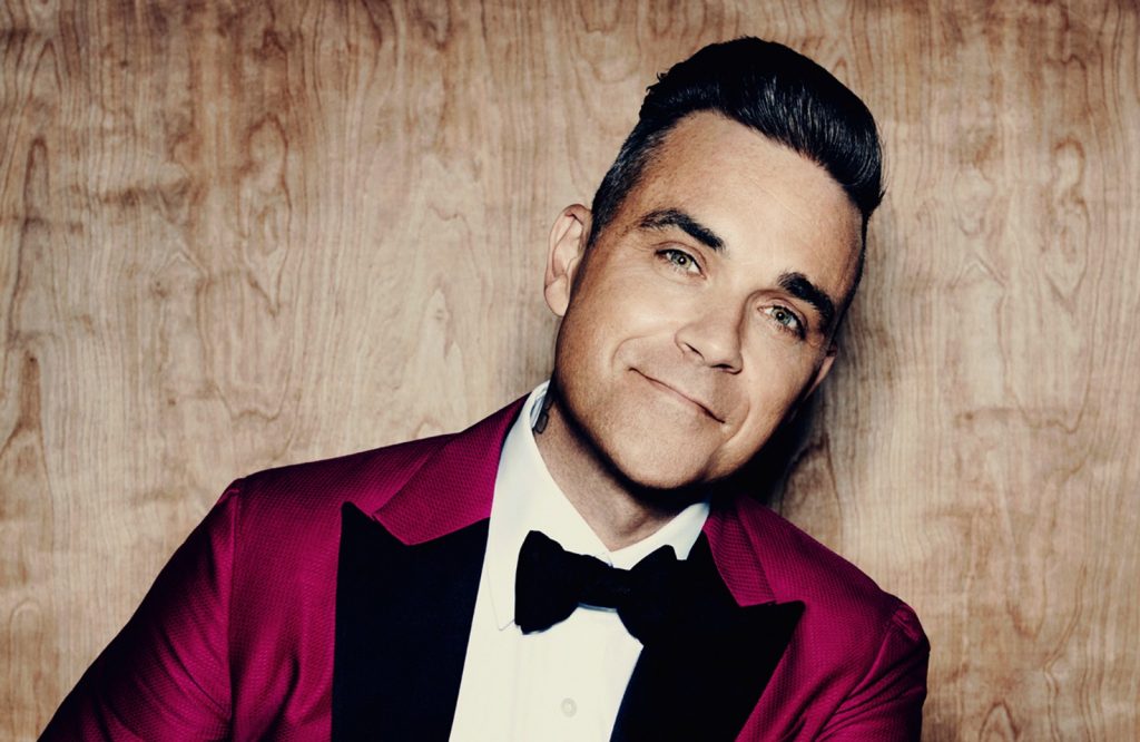 Robbie Williams’ new album debuts at No.1 and breaks UK chart record